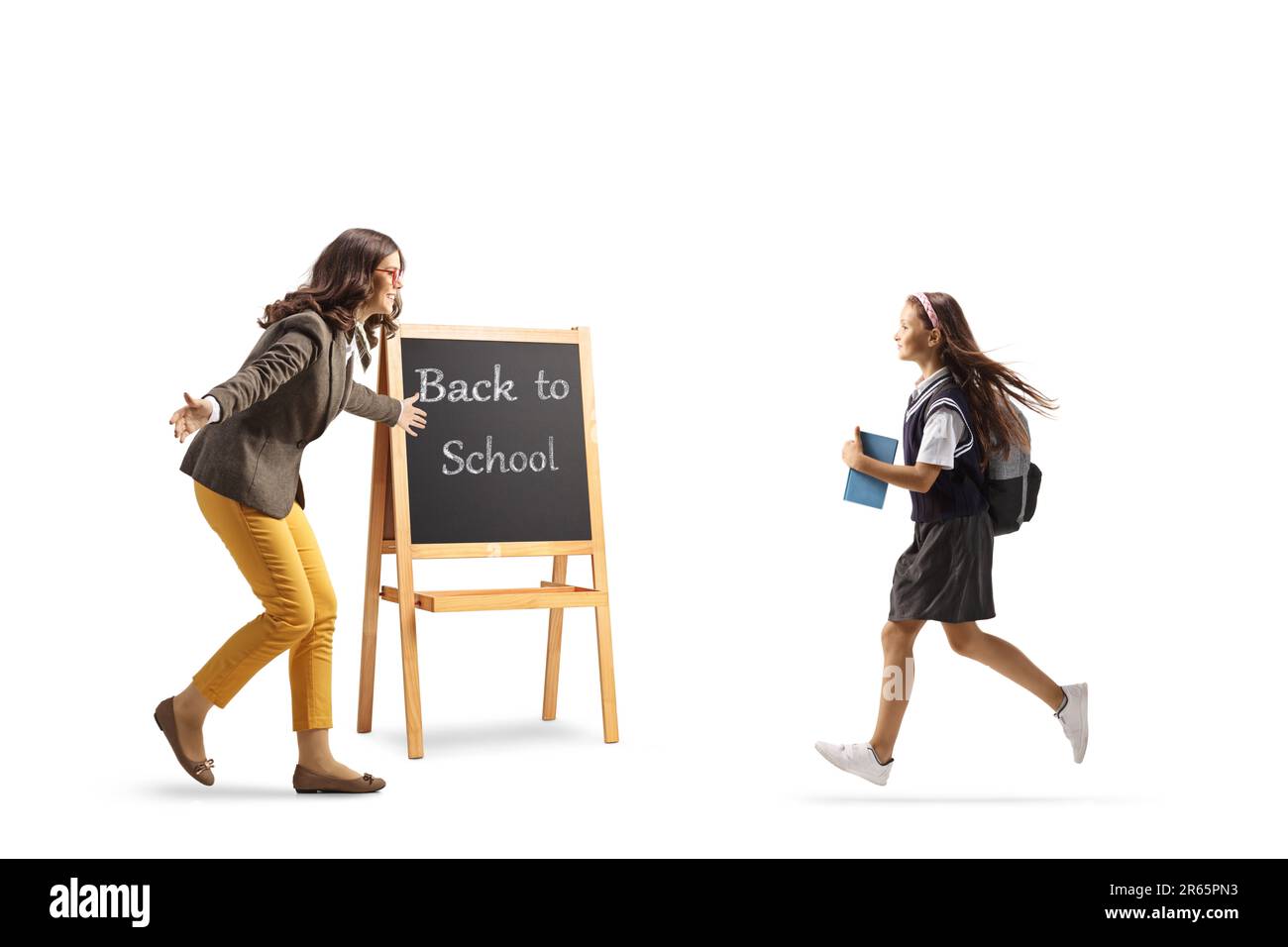 Der Lehrer begrüßt ein Schulmädchen isoliert auf weißem Hintergrund zurück in die Schule Stockfoto