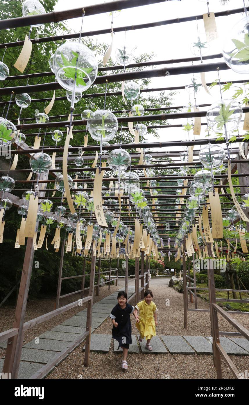Over 2,000 wind chimes are hung in the corridor and swaying in the wind