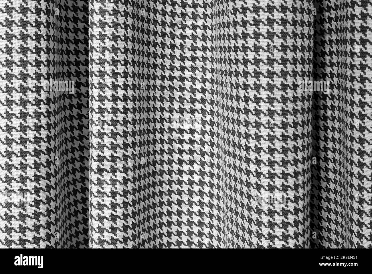 Vorhang, Hahnentrittmuster-Stoff. Schwarze weiße Verdunkelungsvorhänge. Hintergrundstruktur aus Baumwollgewebe, gewellt Stockfoto