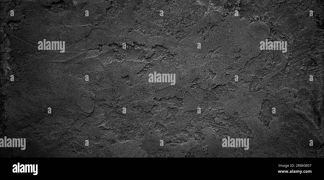 Schwarzer oder dunkelgrauer grober körniger Stein- oder Sandtextur-Hintergrund Stockfoto
