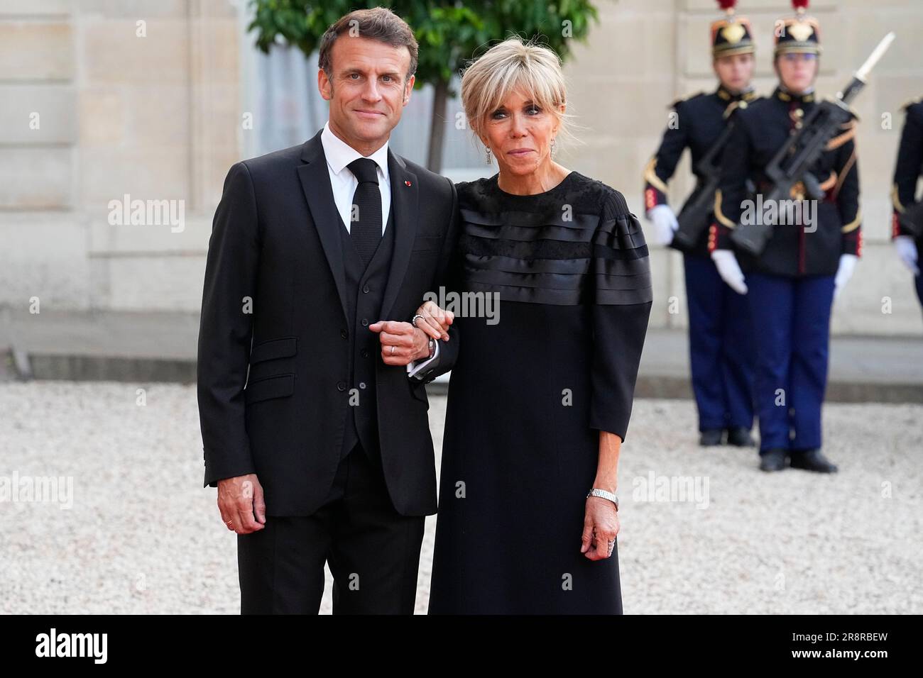 French President Emmanuel Macron And His Wife Brigitte Macron Pose After Welcoming Dignitaries