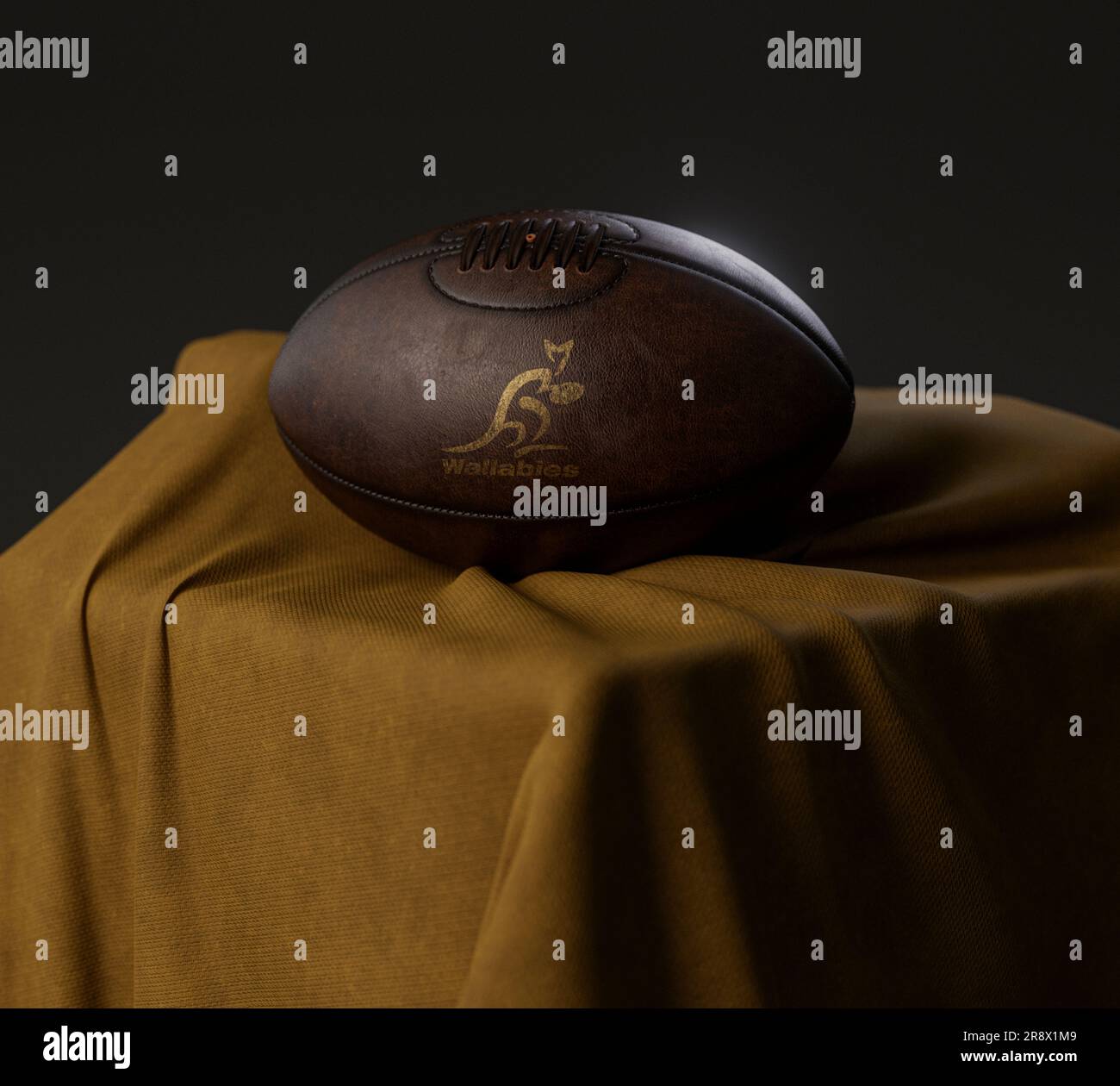 Eine 3D-Darstellung eines Rugby-Balls aus altem Leder mit goldenem Rugby-Logo in australien auf einem goldenen Stoff - 13. Februar 2023 in Bristol, Uni Stockfoto