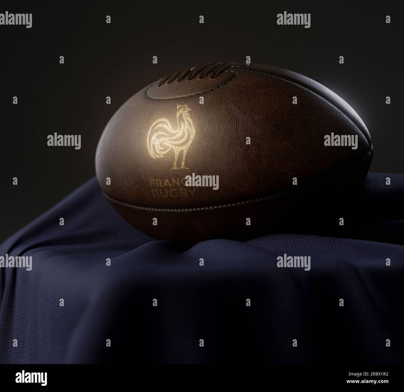 Eine 3D-Darstellung eines Rugby-Balls aus altem Leder mit goldenem Rugby-Logo auf einem marineblauen Stoff - 13. Februar 2023 in Bristol, Großbritannien Stockfoto