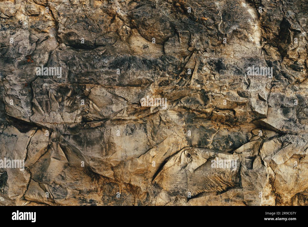 Steinfläche als rauer natürlicher Hintergrund und Textur Stockfoto