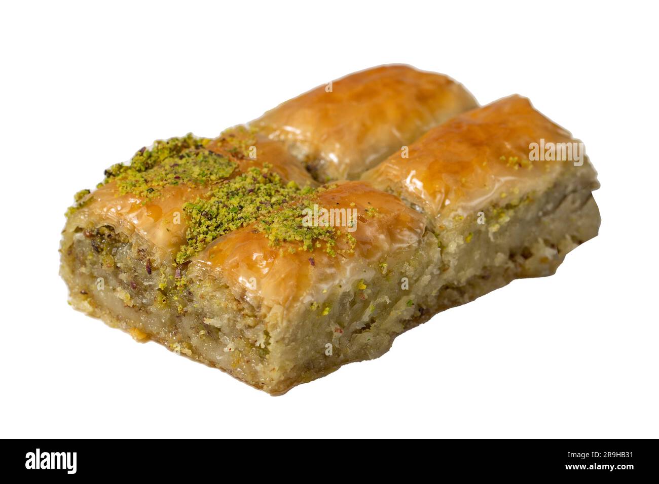 Baklava mit Pistazien, isoliert auf weißem Hintergrund. Traditionelles türkisches Baklava auf einem Teller. Studioaufnahmen. Schließen Stockfoto