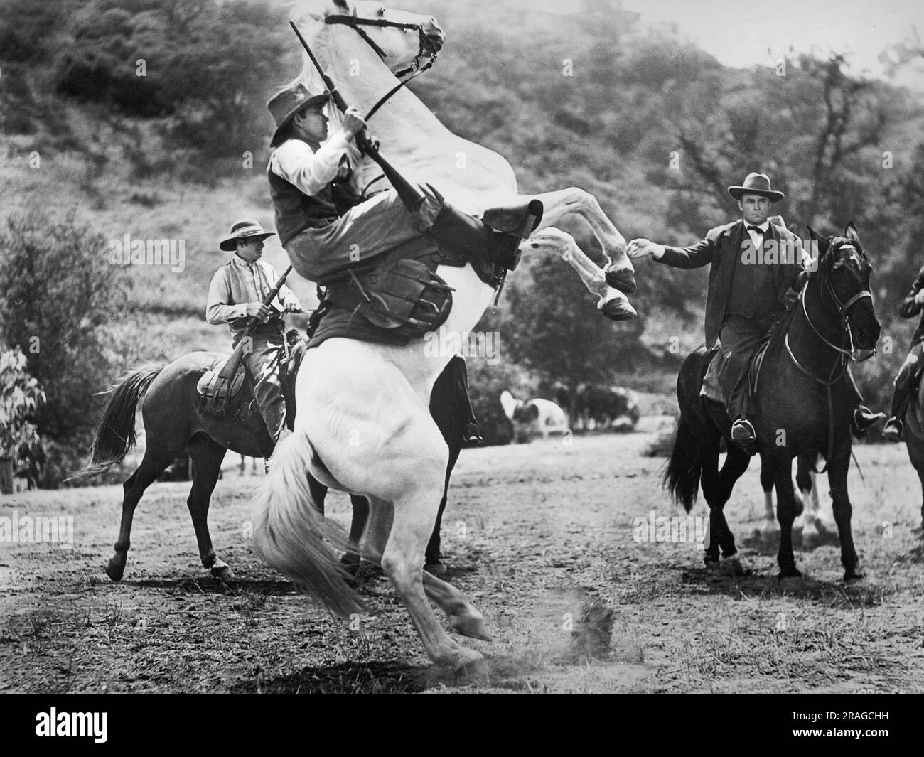 John Loder (auf dem Pferd, rechts), am Filmset, „Diamond Frontier“, Universal Pictures, 1940 Stockfoto