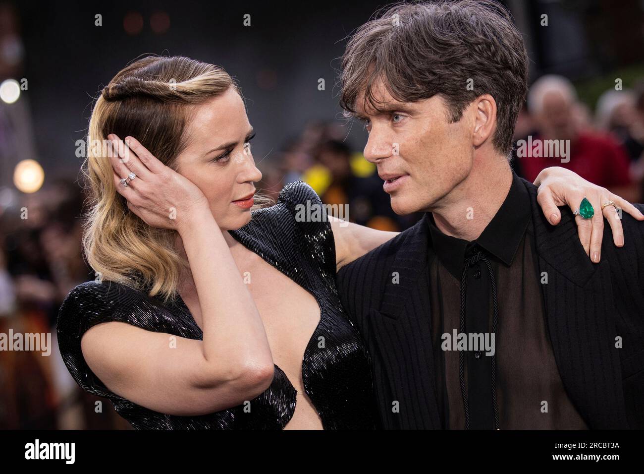 Emily Blunt, left, and Cillian Murphy pose for photographers upon