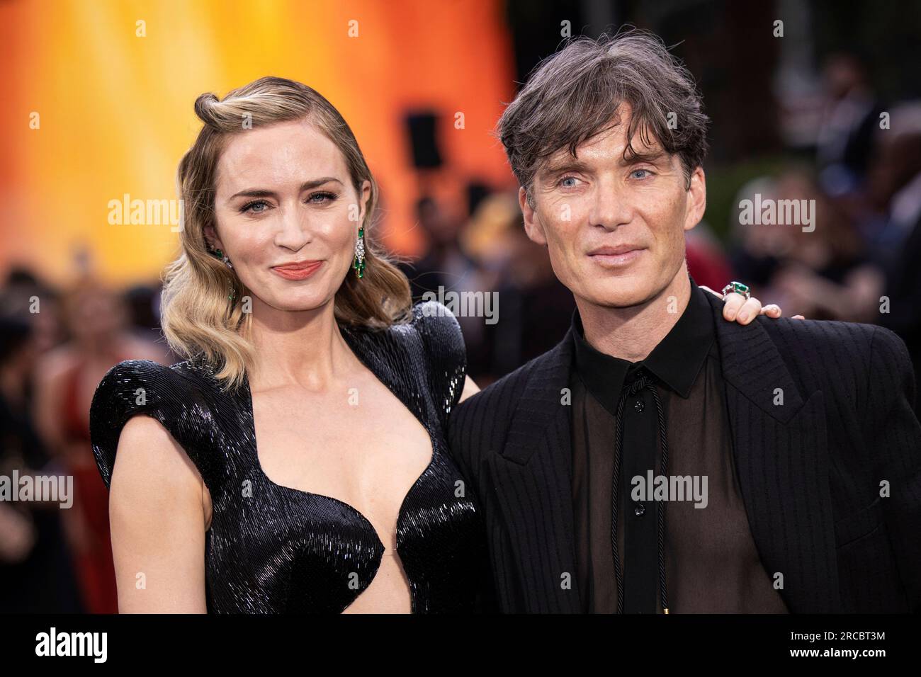 Emily Blunt, left, and Cillian Murphy pose for photographers upon