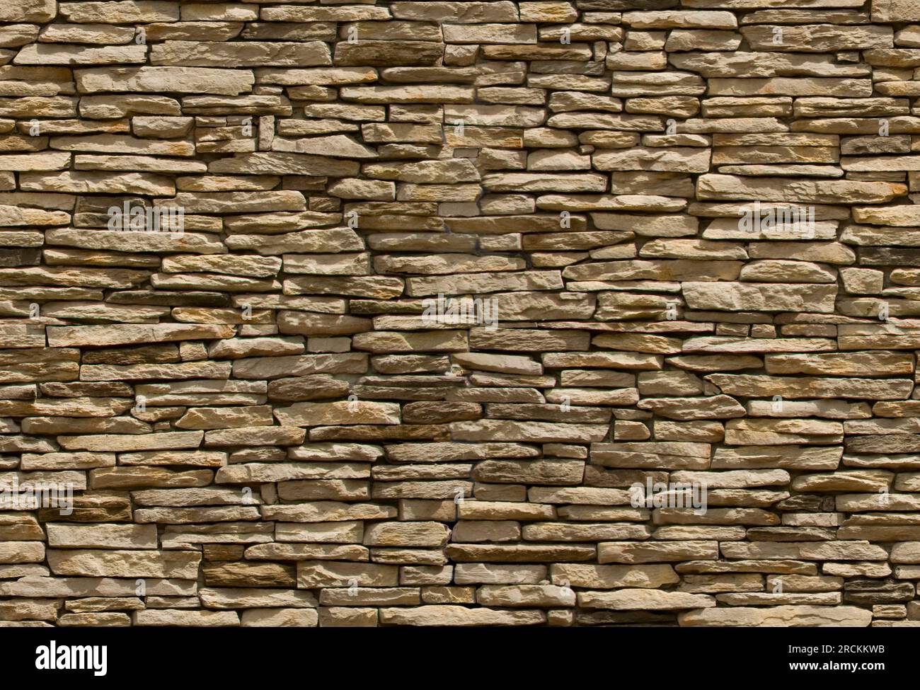Beige und gelbe Mauerwerk-Wandtextur, nahtlos verfliestbar Stockfoto