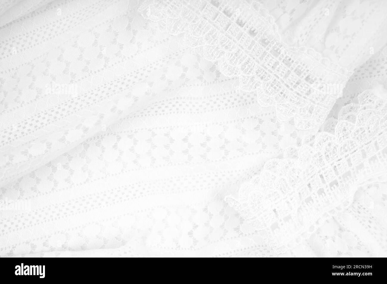Weißer Hintergrund mit Spitzenblume. Hintergrundmuster für Textur. Stockfoto