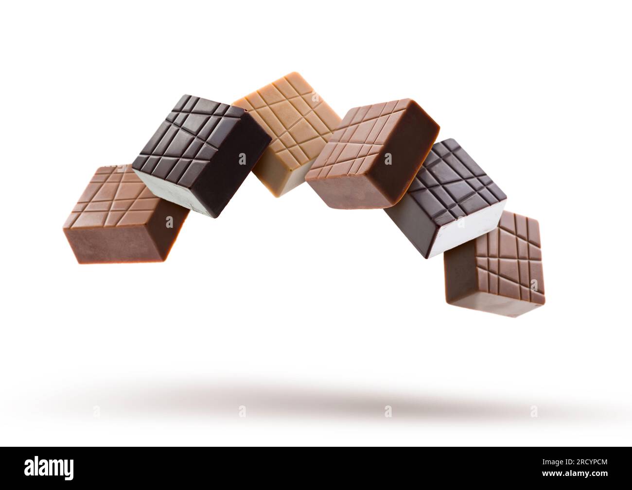 Verschiedene Pralinen aus Schokolade auf weißem Hintergrund Stockfoto