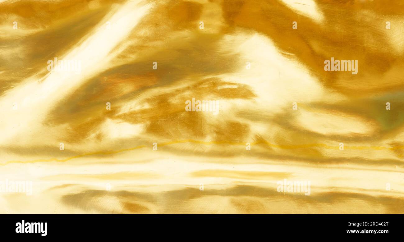 Gebürsteter goldmetallischer Hintergrund oder Struktur aus gebürstetem Stahl Stockfoto