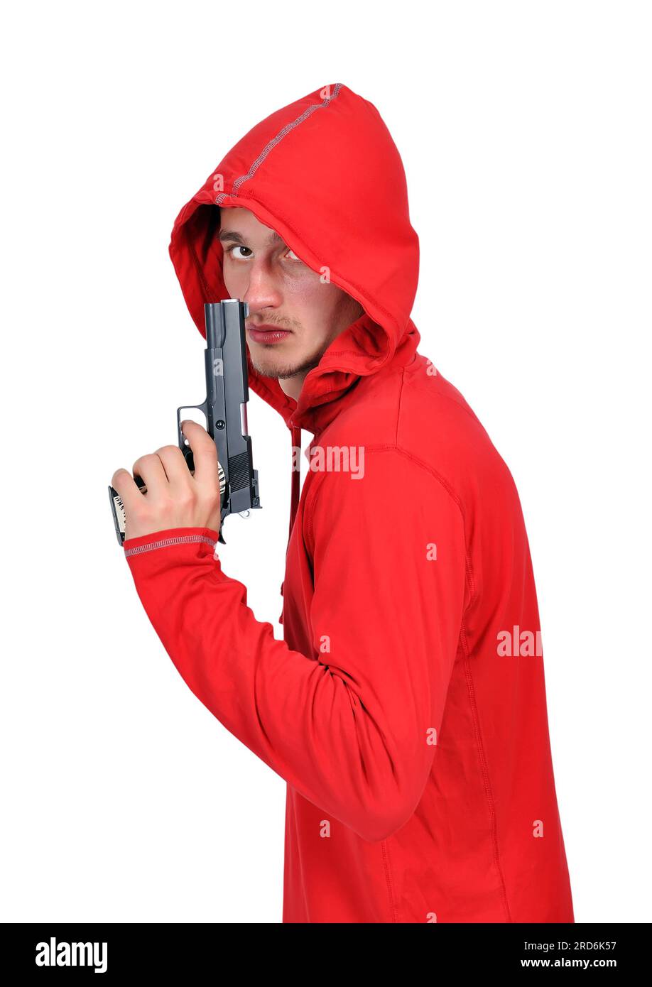 junge Einbrecher mit Gewehr auf einem weißen Hintergrund Stockfoto