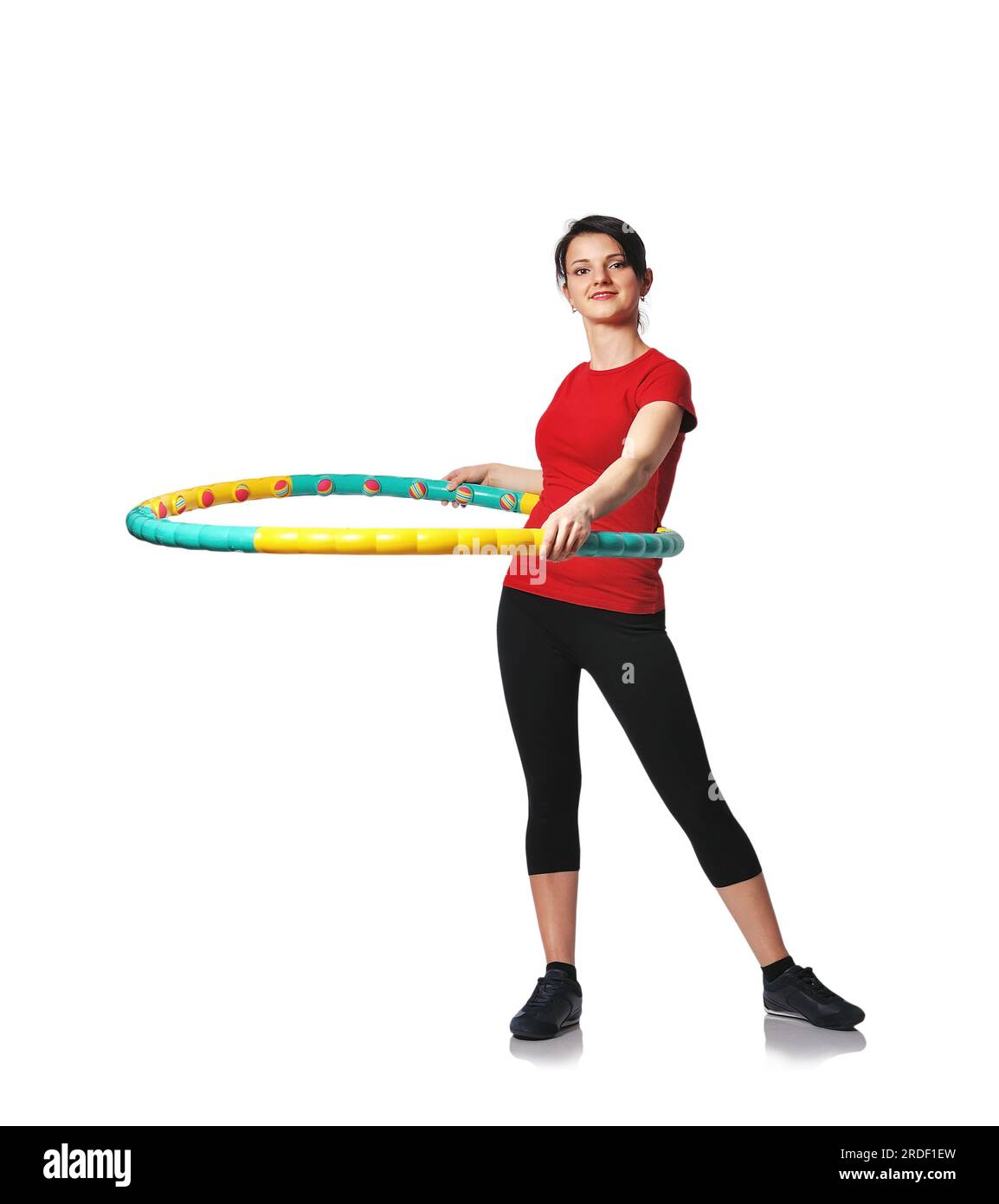 Fitness-Frau hält Farbe Hula-Hoop Stockfoto