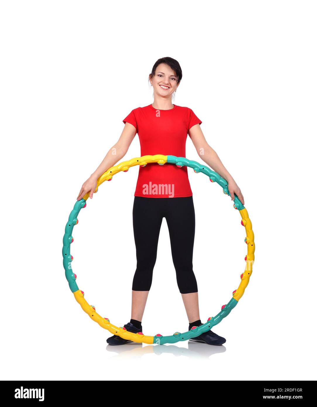 Frau mit Farbe Hula-Hoop auf weißem Hintergrund Stockfoto
