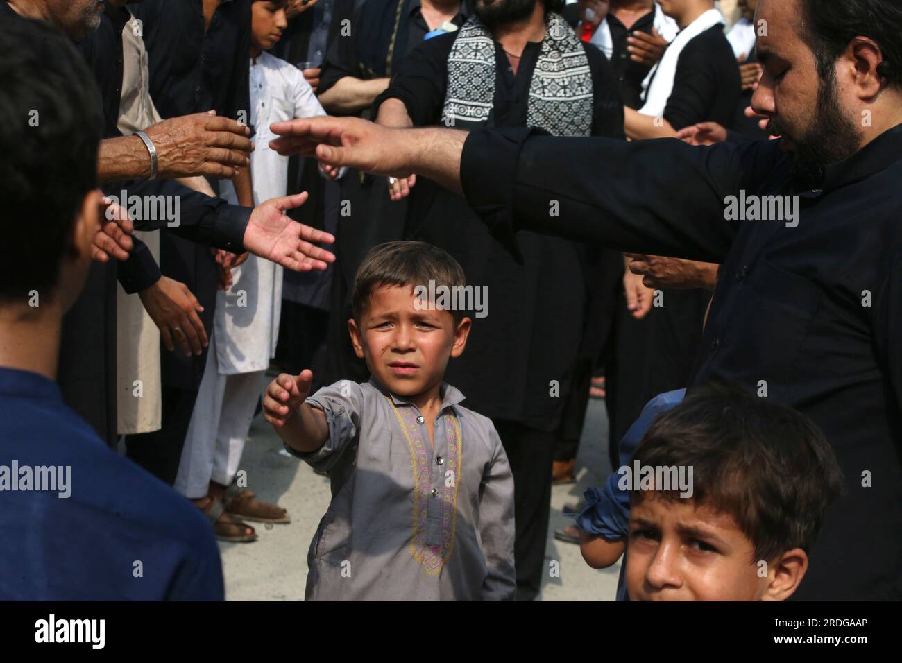 Shiite Muslims beat their chests to show their grief during a ...