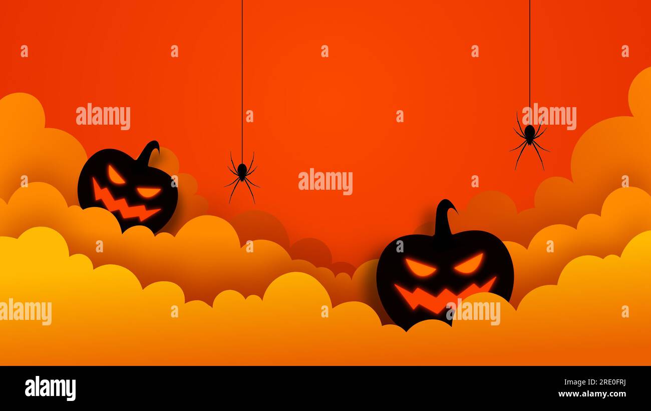 Halloween-Kürbis und Wolken mit hängenden Spinnen Stockfoto
