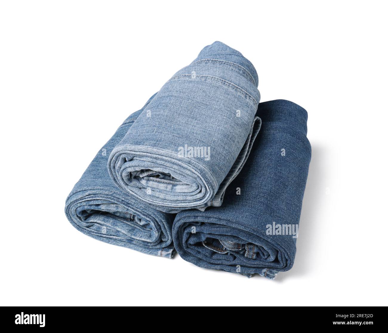 Verschiedene stilvolle Rolljeans isoliert auf Weiß Stockfoto