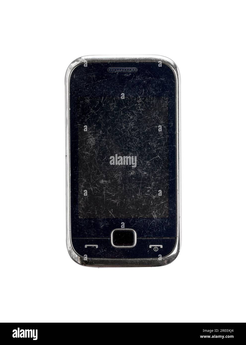 Sehr altes, zerkratztes Handy, isoliert auf weiß Stockfoto