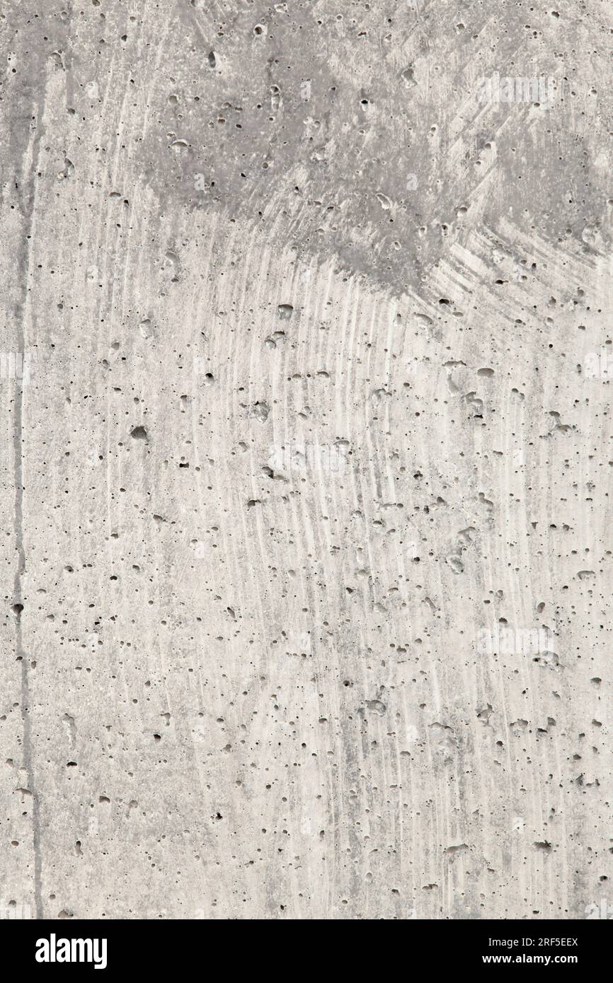 Graue Betonstruktur mit Blasen. Betonhintergrund. Stockfoto