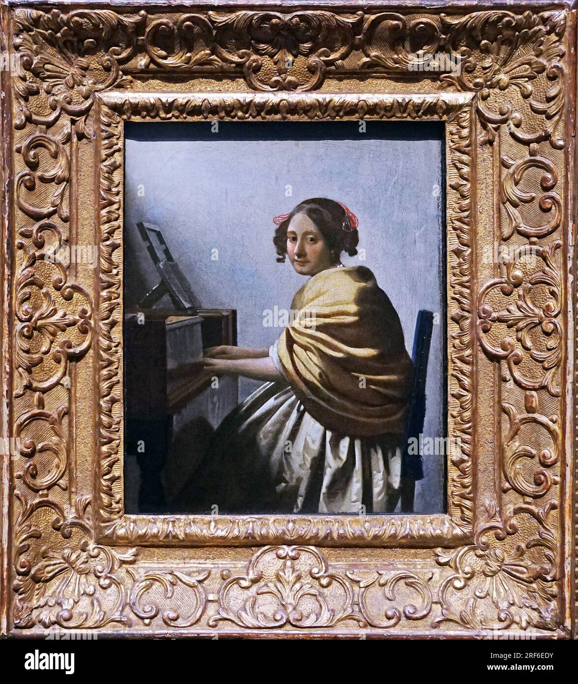 Junge Frau auf dem Platz einer Jungfrau von Johannes Vermeer Jan Vermeer 1632 - 1675. Niederländischer Barockmaler. Stockfoto