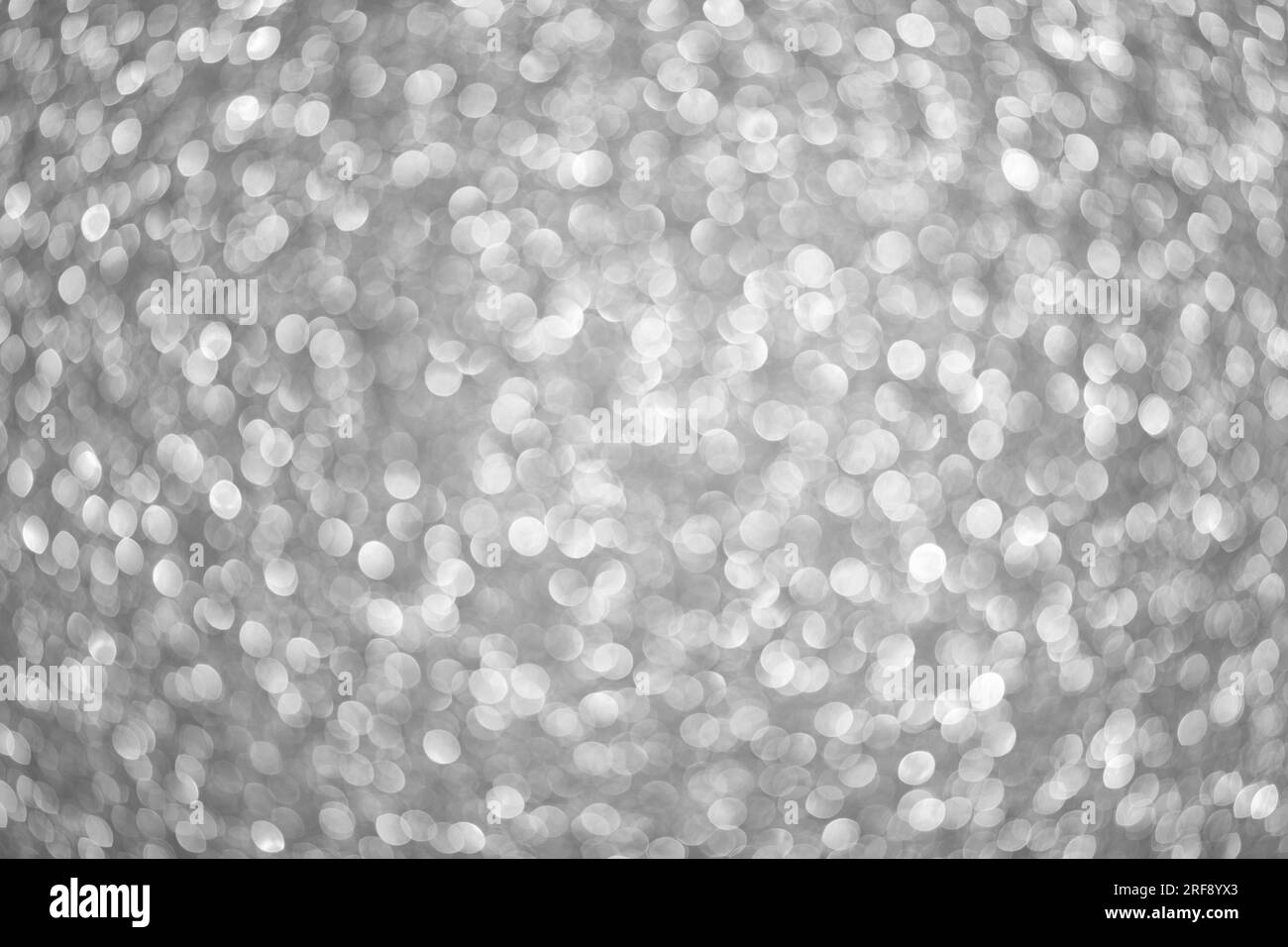 Abstrakt festlich elegant grauen Hintergrund mit verschwommen Bokeh Lichter und Sterne Textur Stockfoto