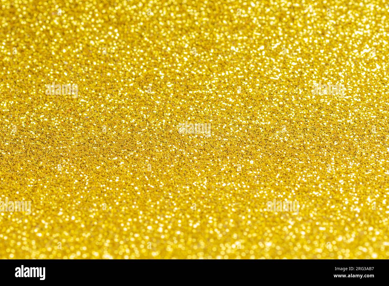 Gold Glitzer Textur glänzend glänzendes Geschenkpapier Hintergrund für Weihnachten saisonbedingtes Tapeten Dekoration, Gruß und Einladung Hochzeit ca Stockfoto