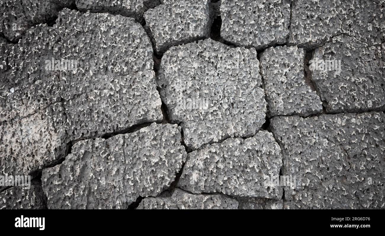 Oberfläche von gesprungenem vulkanischem Felsen, abstrakter Naturhintergrund, Galapagos-Inseln, Ecuador. Stockfoto