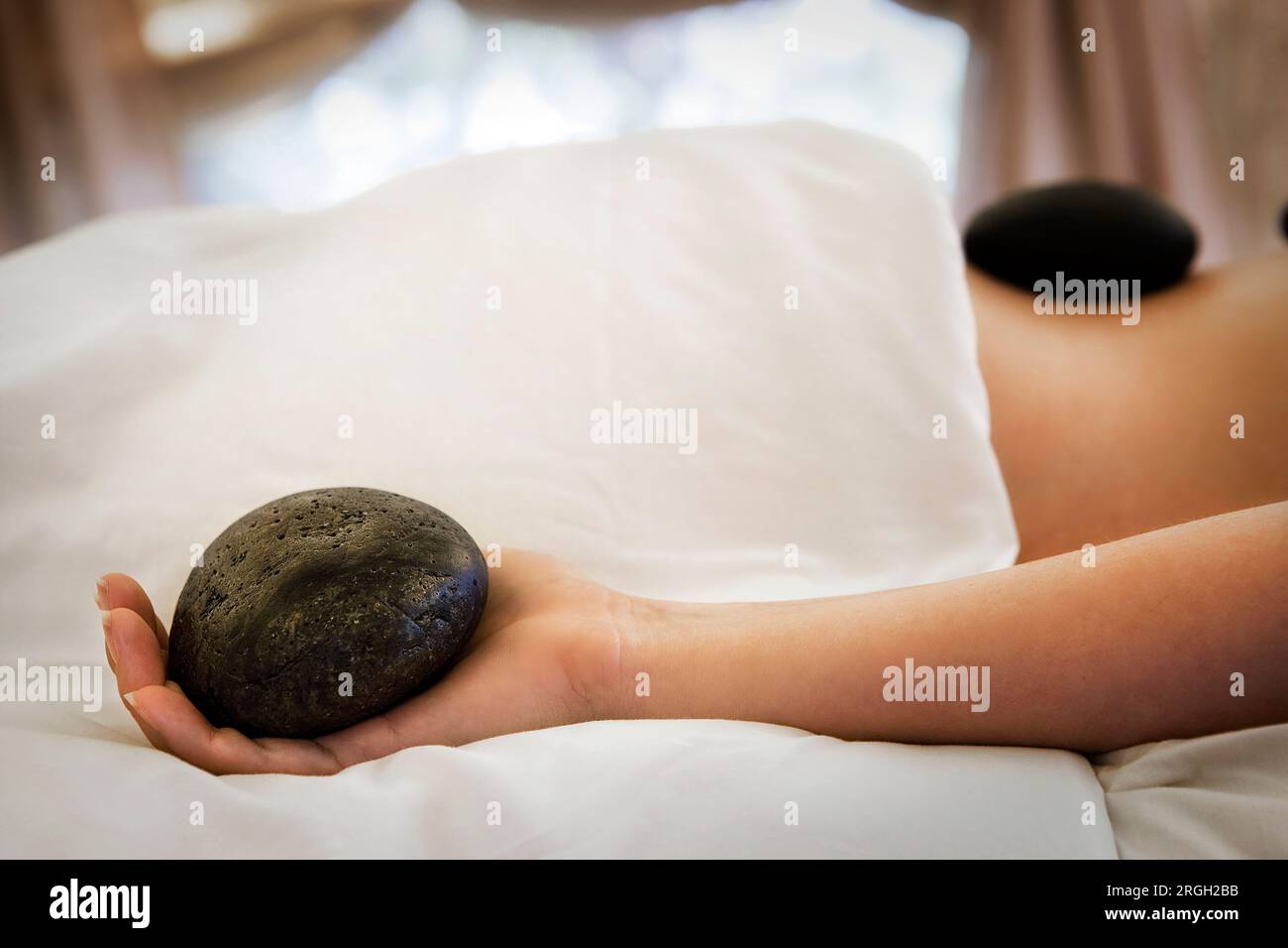 Frau, Lastone Therapie Stockfoto