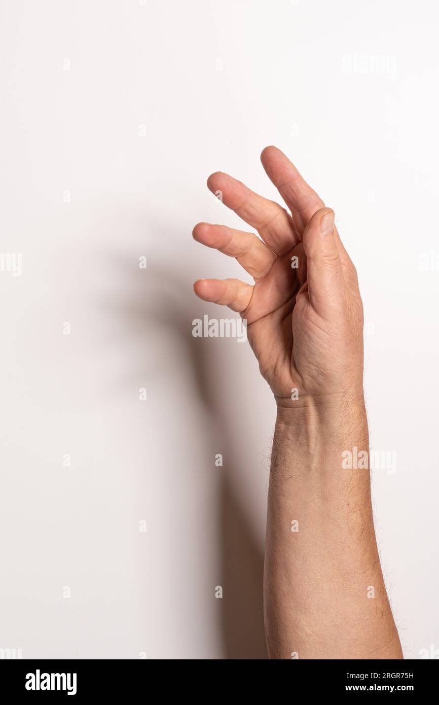 Eine männliche Hand auf weißem Hintergrund Stockfoto