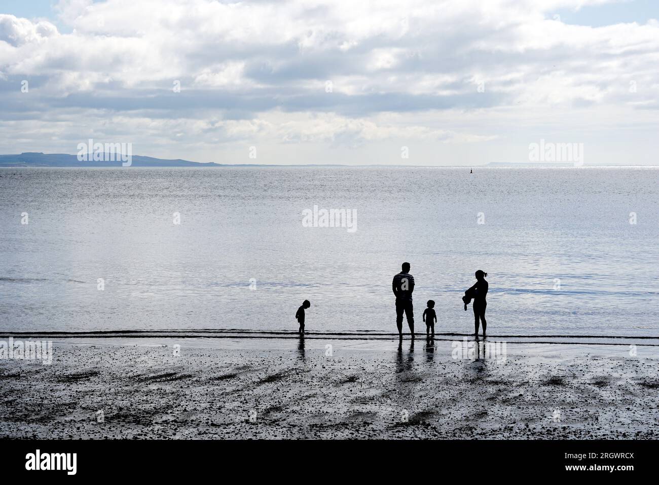 Familie am Strand Stockfoto