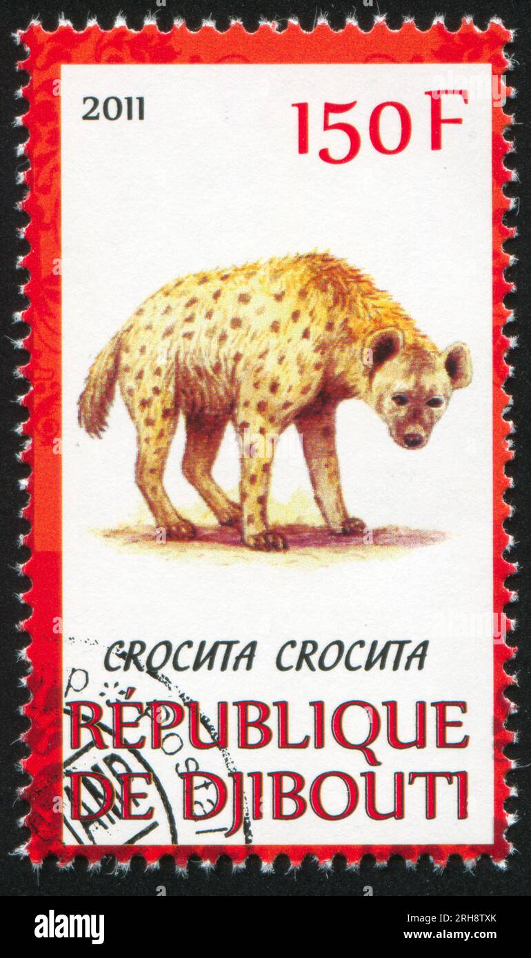 DSCHIBUTI - UM 2011: Stempel gedruckt von Dschibuti, zeigt gepunktete Hyäne, um 2011 Stockfoto