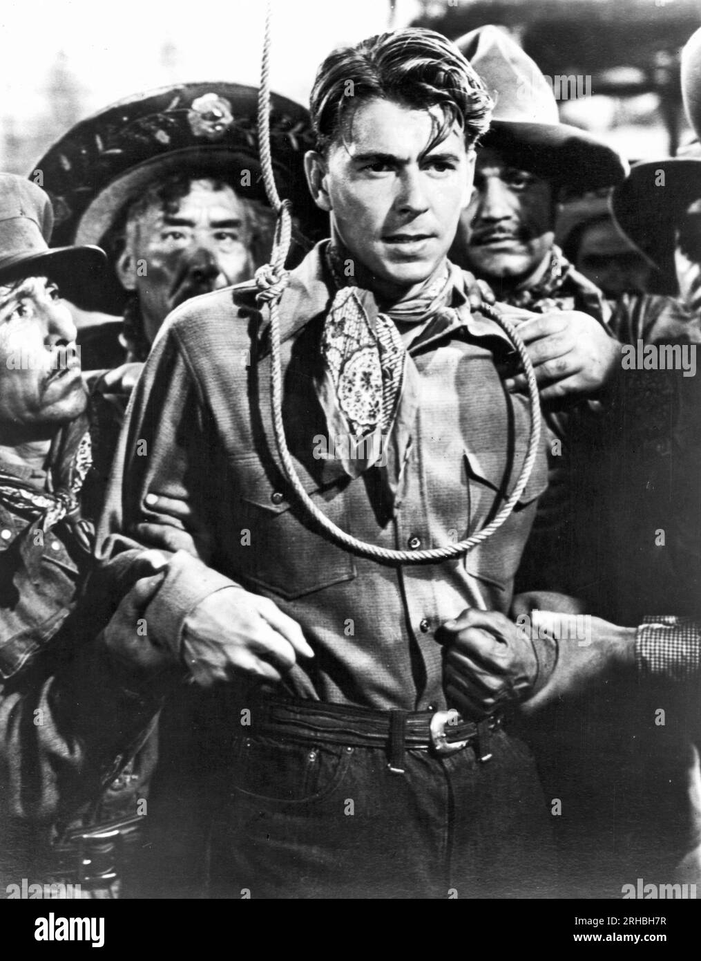 Hollywood, Kalifornien: c. 1941-Schauspieler Ronald Reagan in einer Szene aus dem Western-Film „der böse Mann“. Stockfoto
