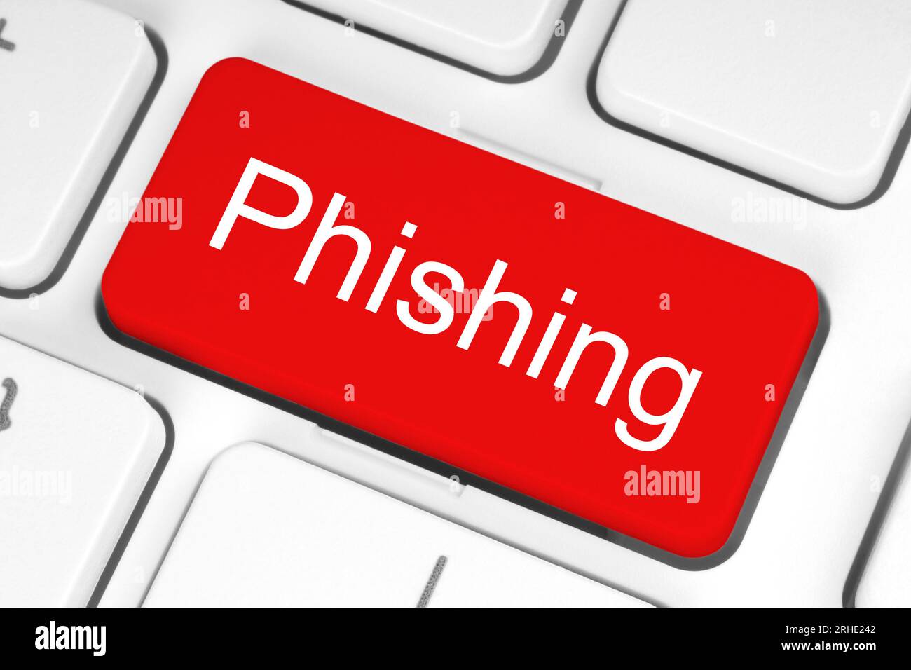 Rote Taste mit Phishing-Wort auf der Tastatur Nahaufnahme, Technologiekonzept Stockfoto