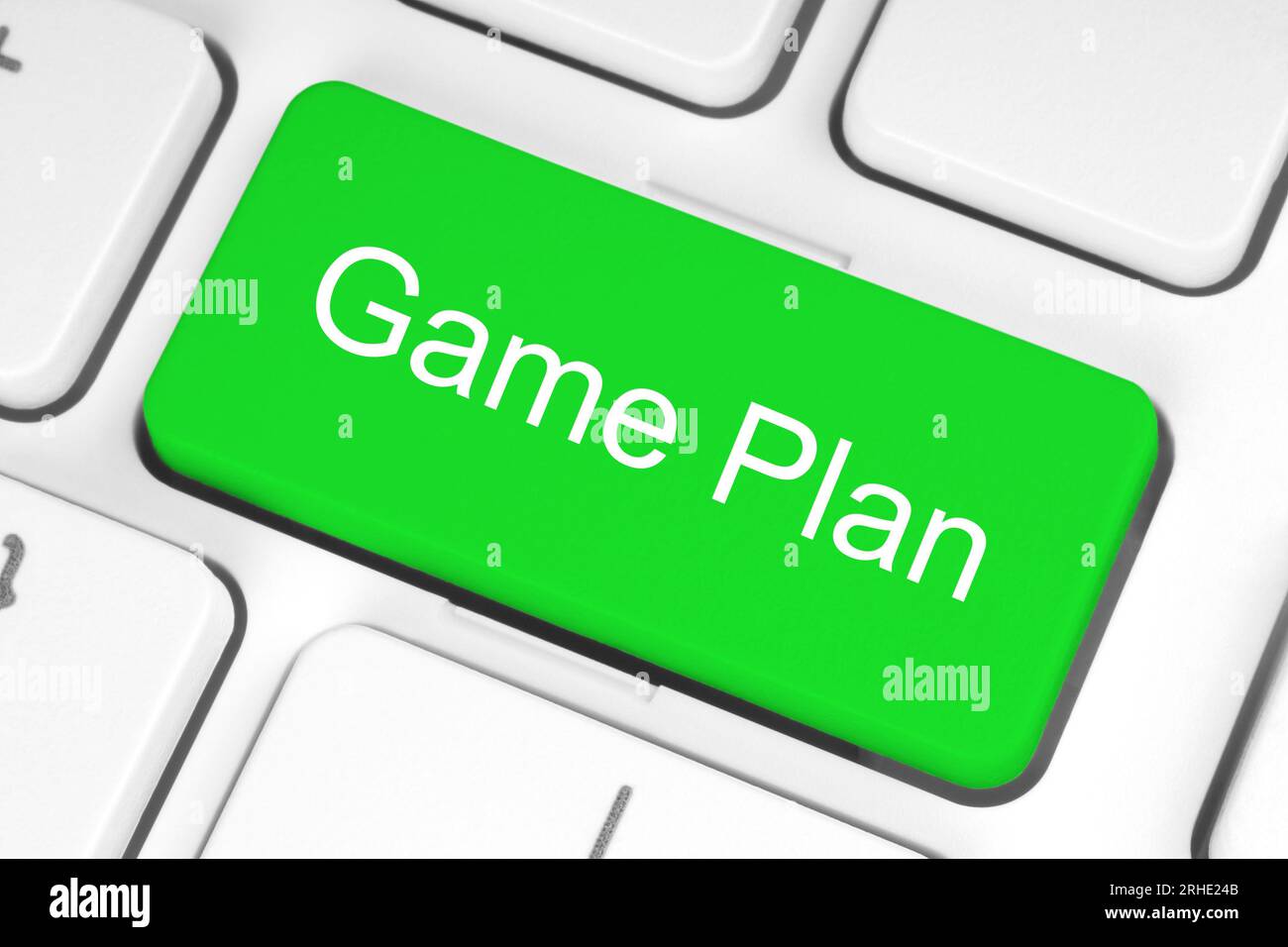 Grüne Schaltfläche mit Wörtern für Spielpläne auf der Tastatur Nahaufnahme, Technologie und Geschäftskonzept Stockfoto