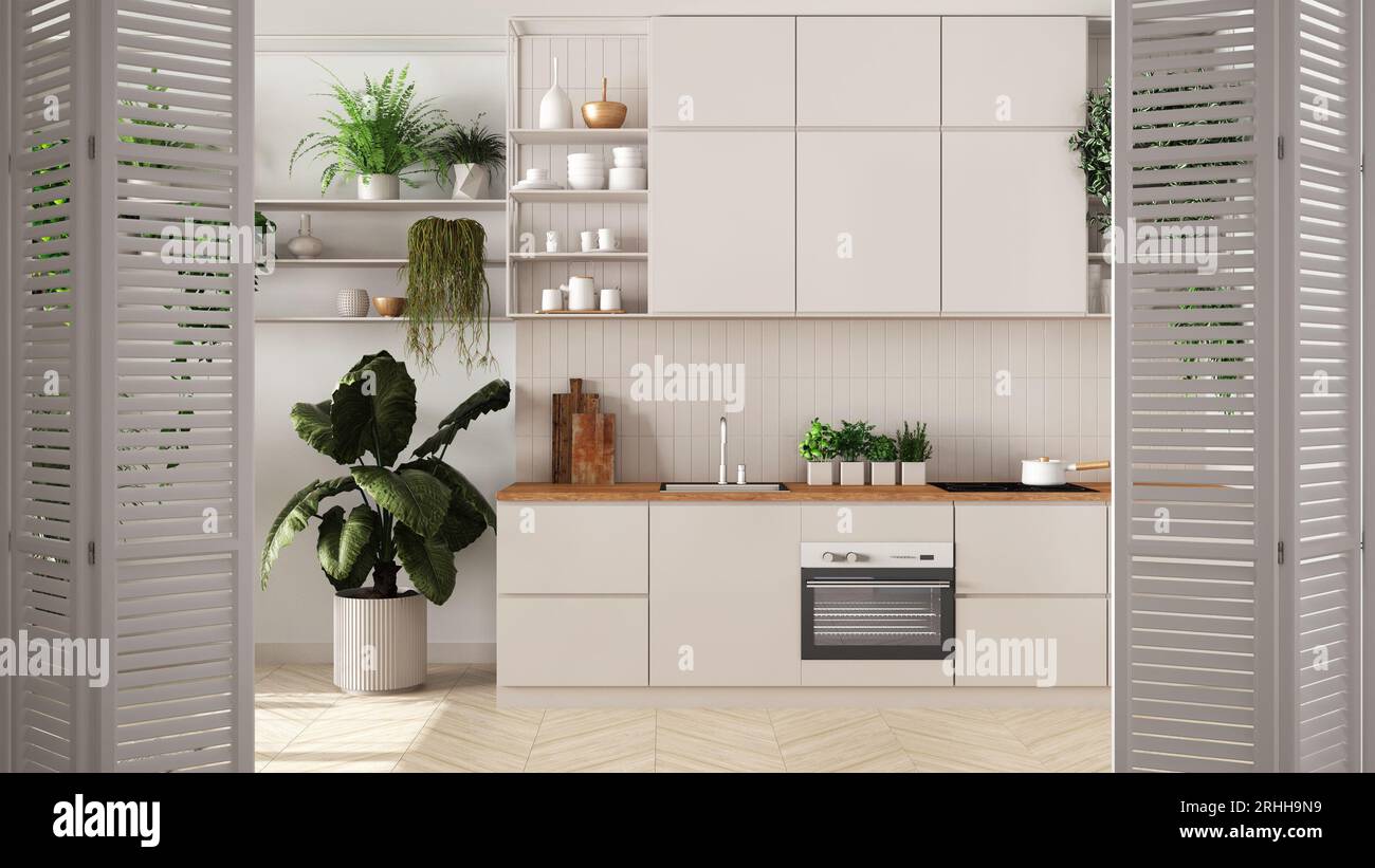 Weiße Falttüröffnung in minimalweißer Küche mit Schränken und Geräten und mit vielen Topfpflanzen, Architekt-Designerkonzept, urbaner Dschungel Stockfoto