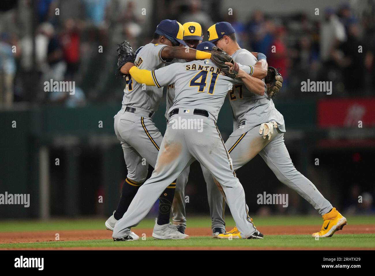 Milwaukee Brewers first baseman Carlos Santana (41) celebrates with teammates after a baseball game against the Texas Rangers in Arlington, Texas, Friday, Aug. 18, 2023. (AP Photo/LM Otero) Stockfoto