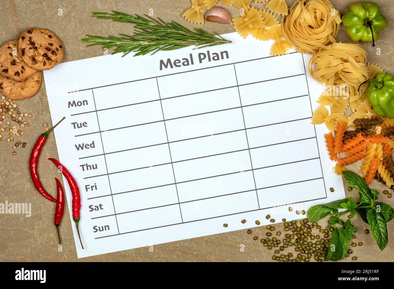 Menü für die Woche - Verpflegungsplan mit einer Grenze von Lebensmitteln Stockfoto