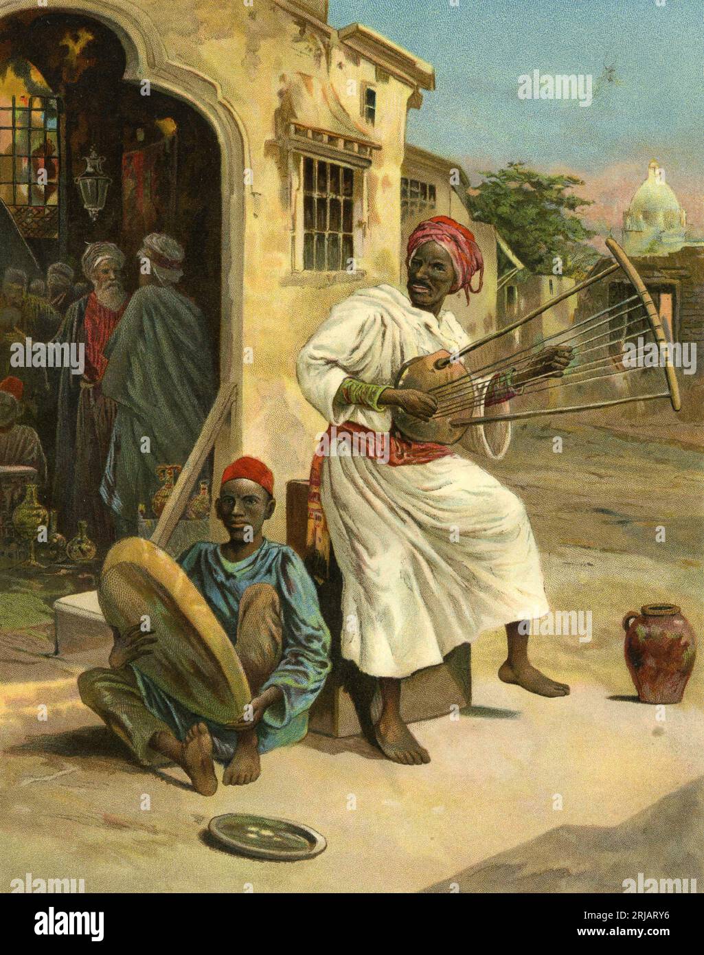 Charmante Chromolithographie maurischer Musiker, die um 1910 in einem Dorf auftreten Stockfoto