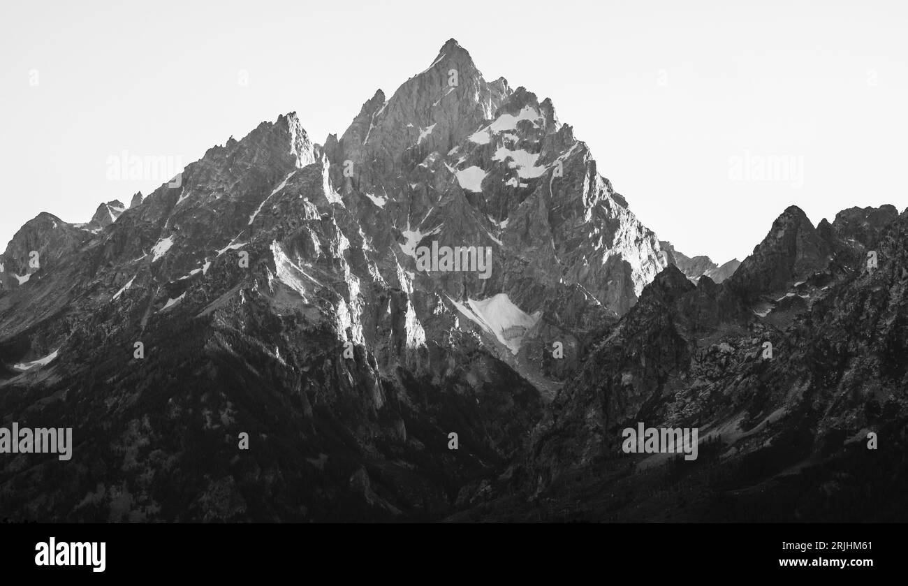 Abendlicht dämpft die Cliffs of Grand Teton bei Sonnenuntergang Stockfoto