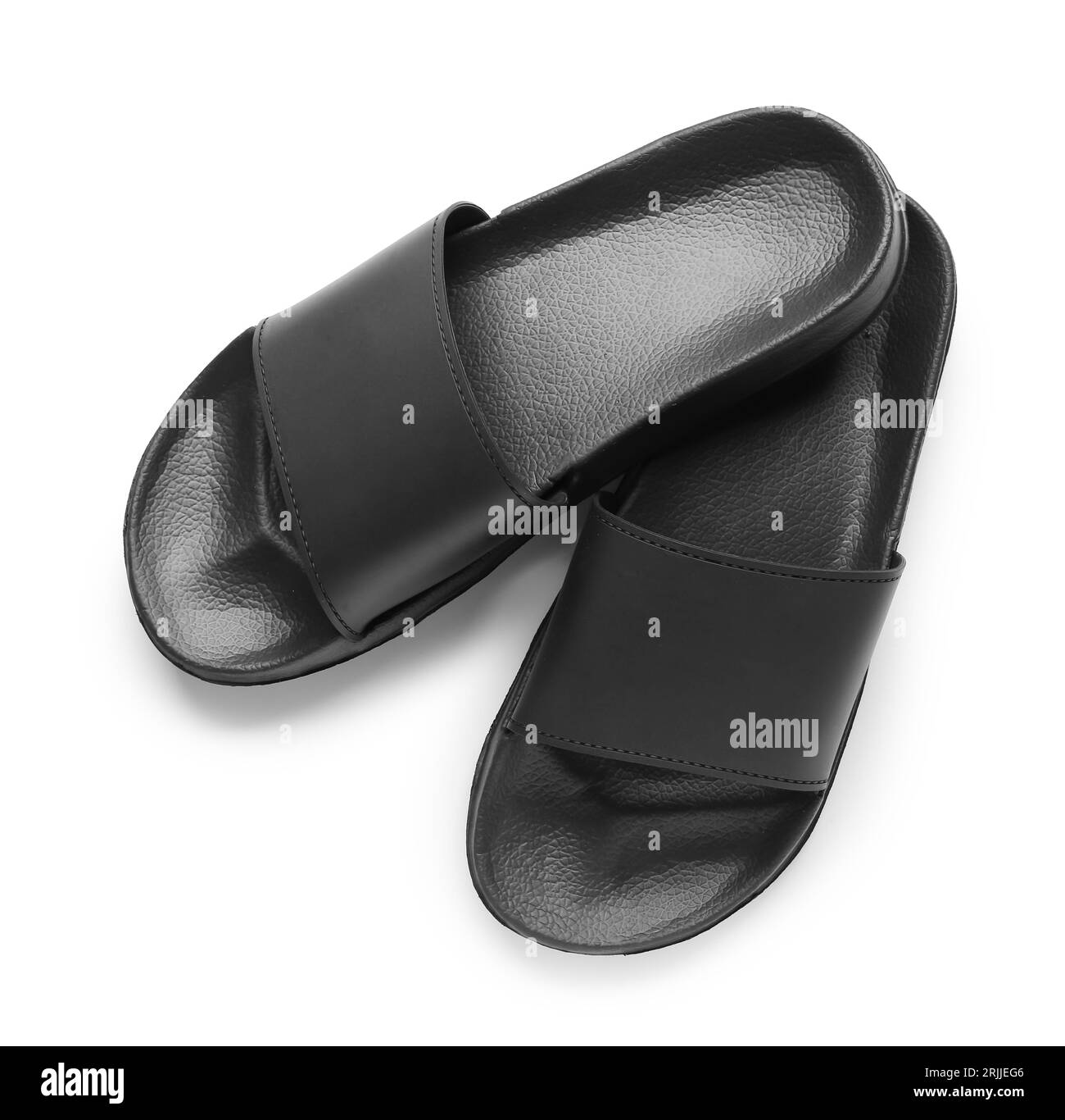 Schwarze weibliche Flip-Flops auf weißem Hintergrund Stockfoto