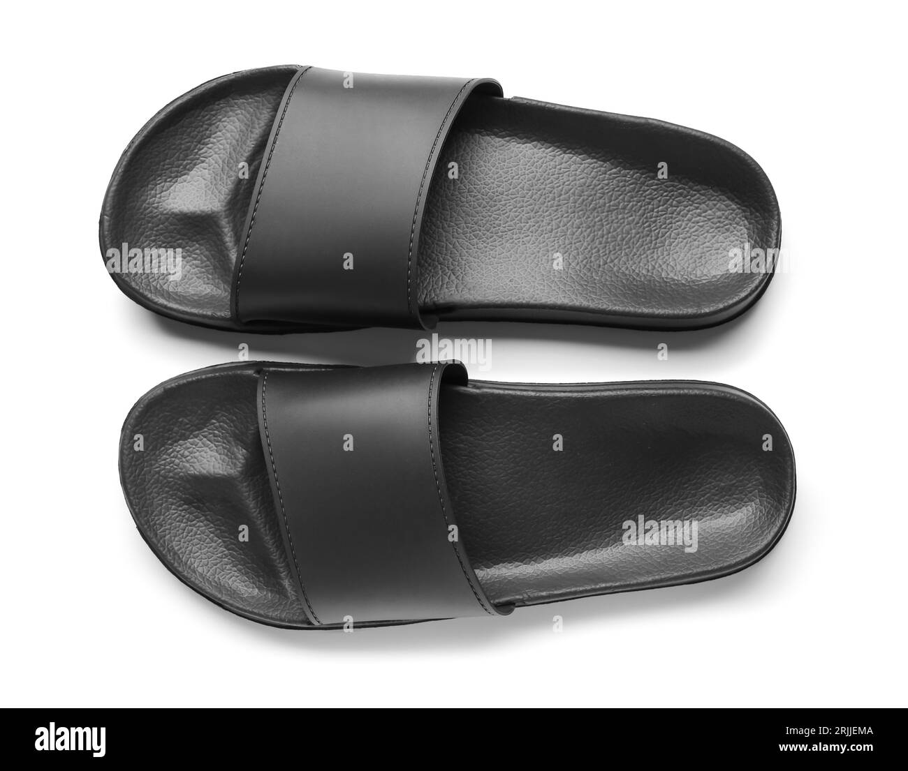 Schwarze weibliche Flip-Flops auf weißem Hintergrund Stockfoto