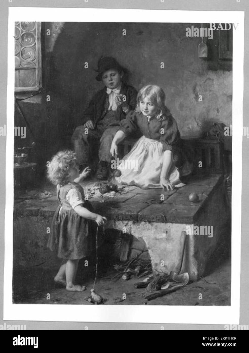 Drei Kinder beim Äpfelbraten zwischen 1848 und 1910 von Felix Schlesinger Stockfoto
