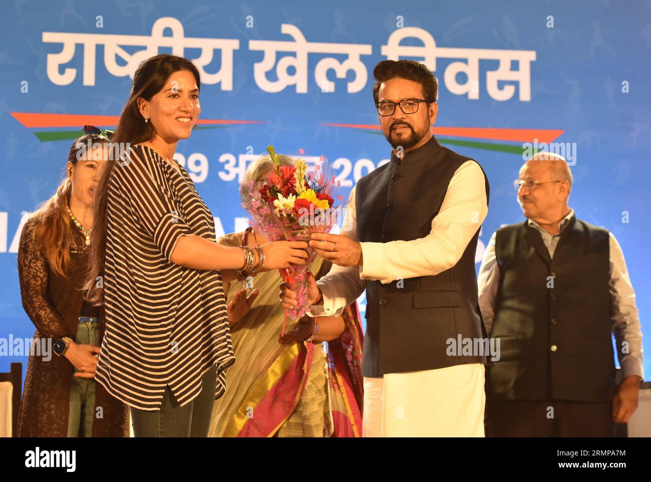 New Delhi, Indien. 29. August 2023. NEW DELHI, INDIEN - AUGUST 29: Der Minister der Union für Jugend und Sport Anurag Singh Thakur mit der Sportministerin Sujata Chaturvedi und der Boxerin Mary KOM, der indische Athlet Anju Bobby Georage, machte am 29. August 2023 in Neu-Delhi, Indien, Sportspieler beim National Sports Day. (Foto: Sonu Mehta/Hindustan Times/SIPA USA) Credit: SIPA USA/Alamy Live News Stockfoto