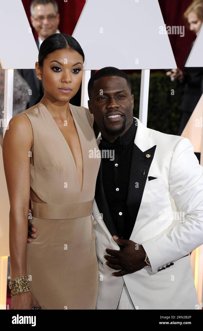 (150223) -- LOS ANGELES, 22. Februar 2015 -- Schauspieler Kevin Hart und Eniko Parrish kommen am 22. Februar 2015 für den roten Teppich der 87th Academy Awards im Dolby Theater in Los Angeles, USA. ) US-LOS ANGELES-OSCARS-ROTER TEPPICH YangxLei PUBLICATIONxNOTxINxCHN Los Angeles 22. Februar 2015 Schauspieler Kevin Hard und Eniko Parrish kommen AM 22. Februar 2015 für den Red Carpet der 87th Academy Awards IM Dolby Theatre in Los Angeles in den USA an Stockfoto