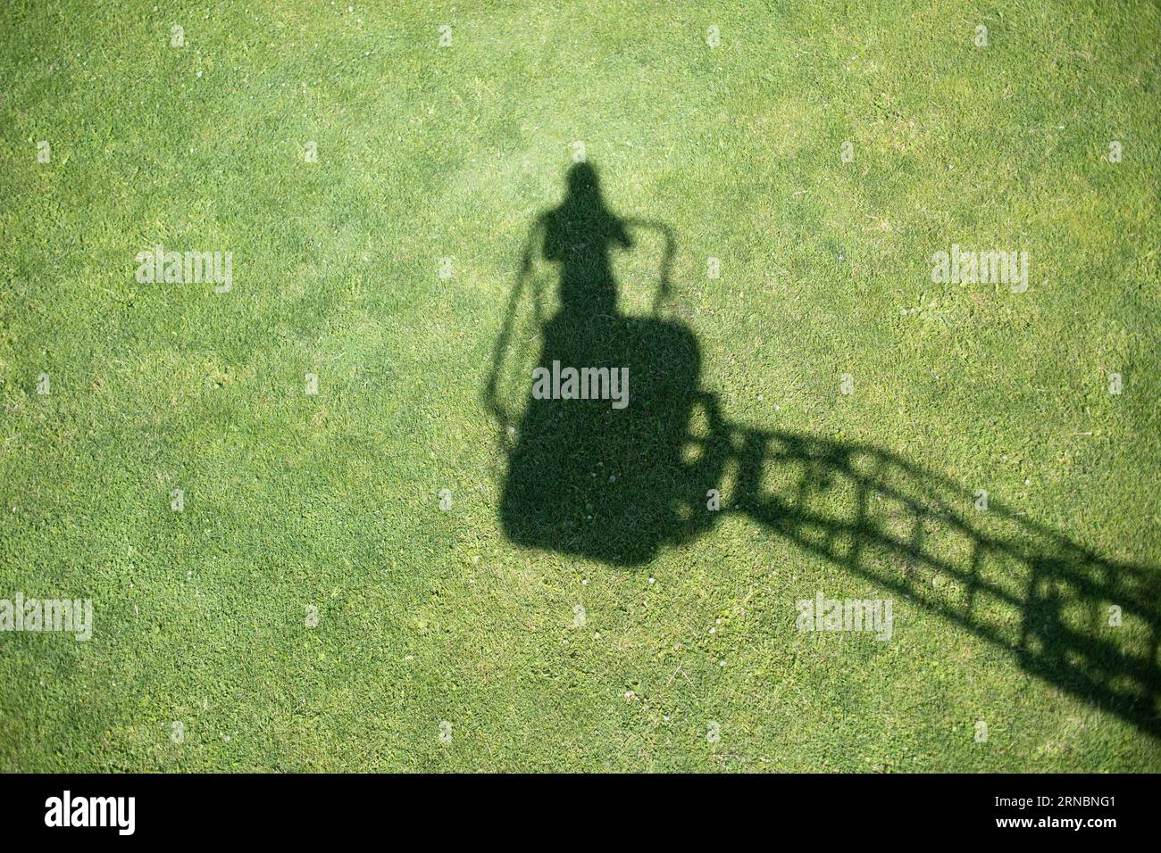 Schatten eines Fotografen, der auf dem Lift steht. Stockfoto