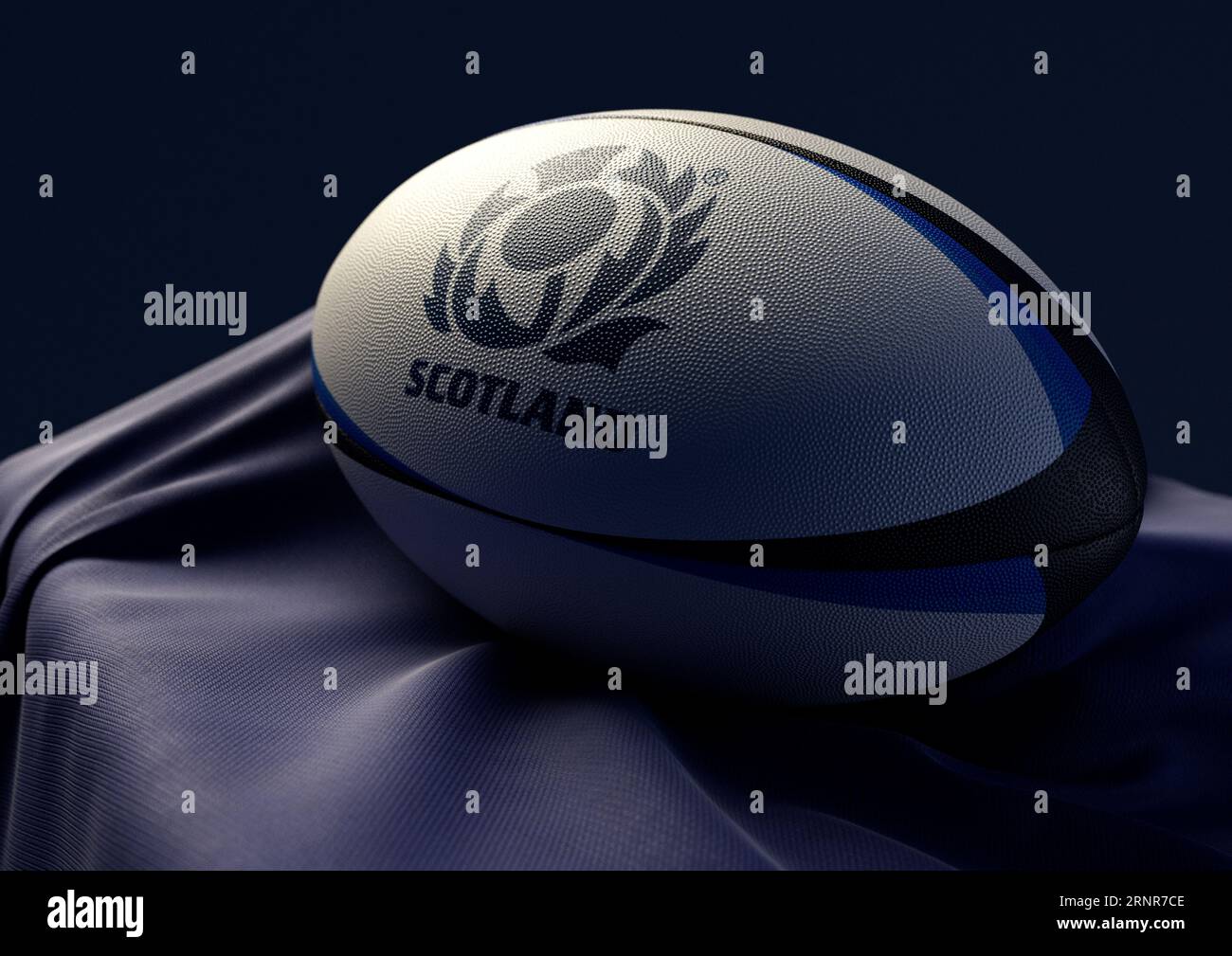 2. September 2023 - Bristol, Großbritannien: Ein 3D-Bild eines Rugby-Balls mit dem Aufdruck des schottischen Rugby-Logos auf einem drapierten blauen Stoff Stockfoto
