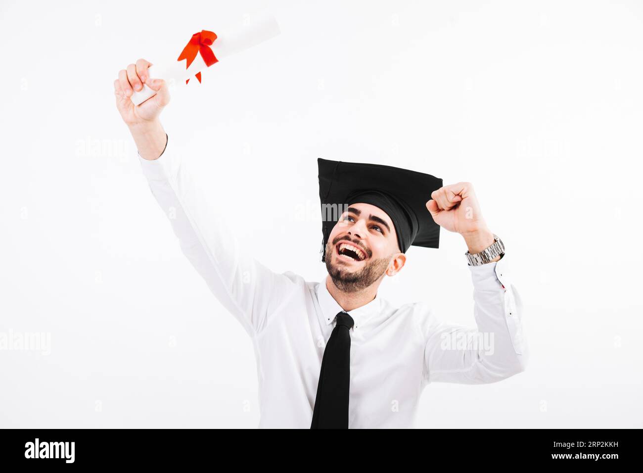 Glücklicher Mann mit akademischem Abschluss Stockfoto