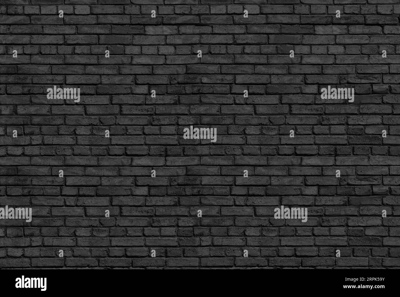 Alte schwarze Ziegelwand Hintergrund Stockfoto