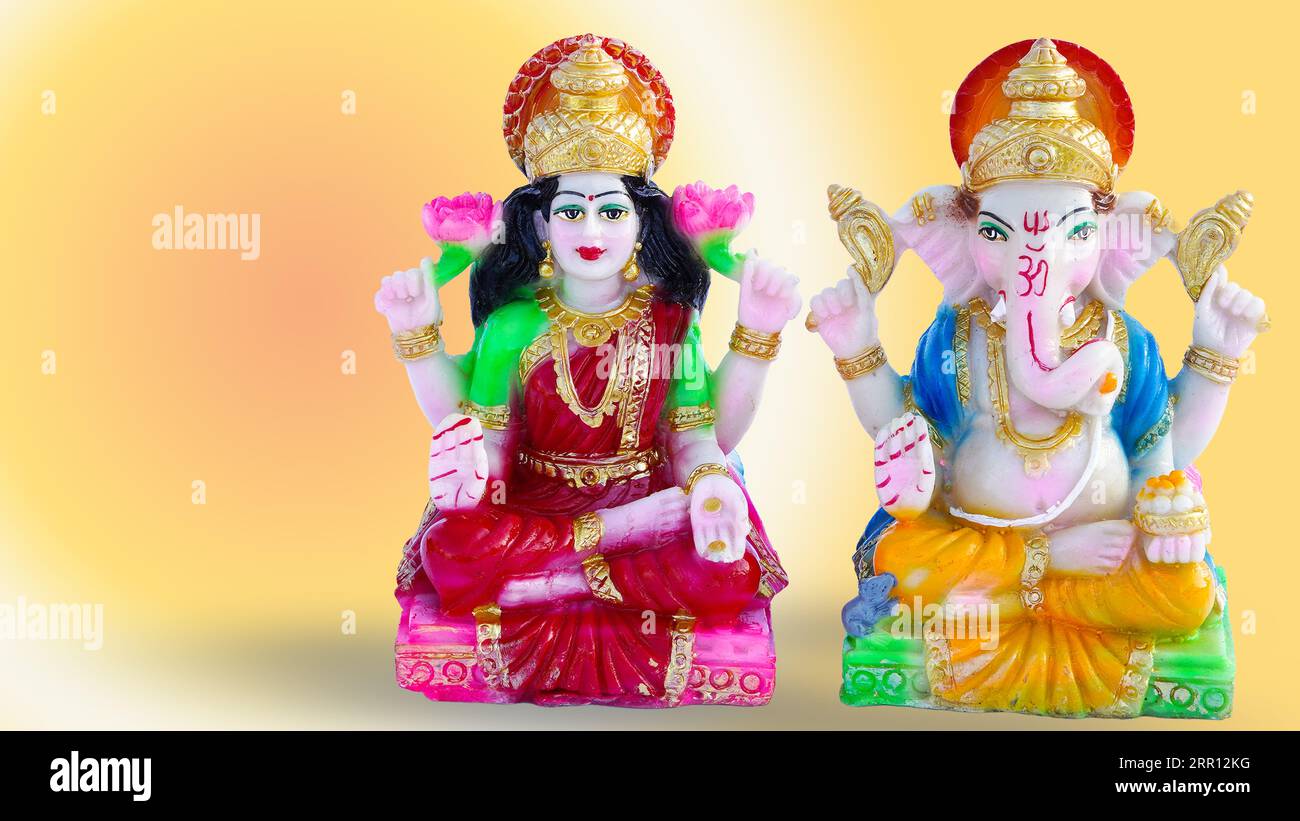 Lord ganesha mit Göttin laxmi auf buntem Hintergrund. Indisches Religionskonzept. Stockfoto